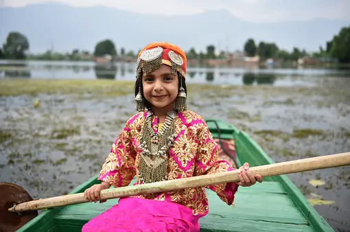 A small girl on a family trip to kashmir with her familyt